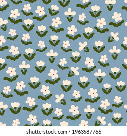 Vector  floral seamless pattern. Simple and cute white flowers on blue  background. Floral endless print for fabric design. Perfect for summer female dresses.
