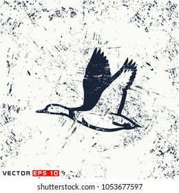 vector fly duck silhouette on grunge background