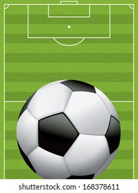A vector football - soccer ball on a grass textured field. EPS 10. File contains transparencies and a gradient mesh.
