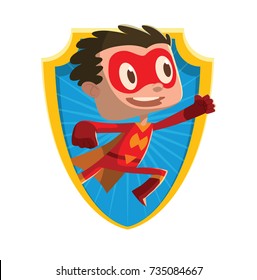 Vector frame in the form of a yellow-blue shield with cartoon image of a funny little boy in a red superhero costume with a yellow cloak flying and smiling on a white background. Halloween, holiday.