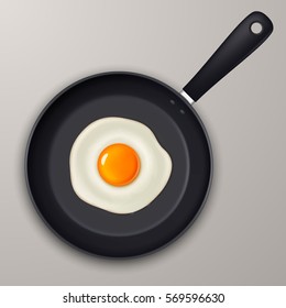 Vector fried egg on a black pan. Realistic icon.