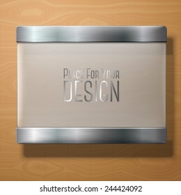 Vector frosted glass plate with metal holders, for your signs, on wooden background.
