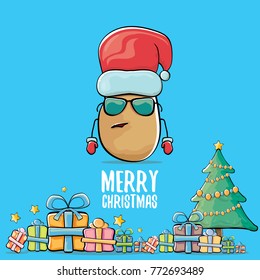 vector funky comic cartoon cute brown smiling santa claus potato with red santa hat, gifts, tree and calligraphic merry christmas text isolated on blue background. vegetable funky christmas character