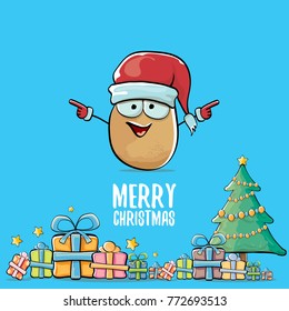 vector funky comic cartoon cute brown smiling santa claus potato with red santa hat, gifts, tree and calligraphic merry christmas text isolated on blue background. vegetable funky christmas character