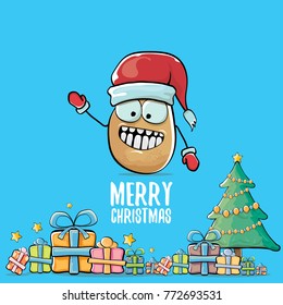 vector funky comic cartoon cute brown smiling santa claus potato with red santa hat, gifts, tree and calligraphic merry christmas text isolated on blue background. vegetable funky christmas character