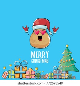 vector funky comic cartoon cute brown smiling santa claus potato with red santa hat, gifts, tree and calligraphic merry christmas text isolated on blue background. vegetable funky christmas character