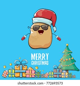 vector funky comic cartoon cute brown smiling santa claus potato with red santa hat, gifts, tree and calligraphic merry christmas text isolated on blue background. vegetable funky christmas character