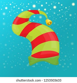 vector funky red and green stripped cartoon christmas elf hat on azure sky background with stars. vector kids colorful elf hat icon or label. Christmas decorative design element for banner or poster