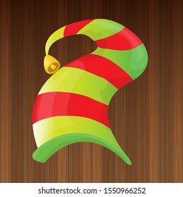 vector funky red and green stripped cartoon christmas elf hat isolated on wooden background. vector kids colorful elf hat icon or label. Christmas decorative design element for banner, flyer or poster