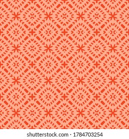 Vector geometric seamless pattern. Abstract red and coral ethnic texture with ornamental grid, mesh, lattice, cross shapes. Tribal ethnic motif. Folk style background. Repeat design for decor, textile