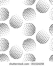 Vector geometric seamless pattern. Repeating abstract circles gradation in black and white. Modern halftone circle design, pointillism