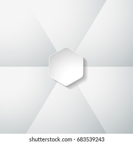 Vector geometric template with hexagonal shape cut from paper with shadow on the gradient gray background composed of segments.