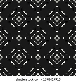 Vector geometric traditional folk ornament. Ethnic seamless pattern. Minimal ornamental background with small squares, diamonds, floral silhouettes. Black and white texture. Dark repeat design