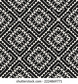 Vector geometric traditional folk ornament. Modern ethnic style seamless pattern. Ornamental geo background with small squares, snowflakes, floral shapes. Monochrome texture of embroidery, knitting