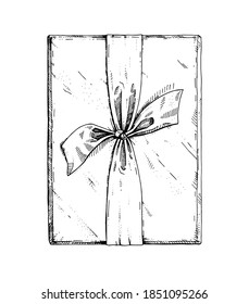 Vector gift with a bow. A hand-drawn sketch. Vintage style engraving. Gift box top view. Festive single packaging with ribbon. Drawing in ink, liner. Isolated object on a white background