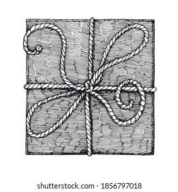 Vector gift of rectangular shape with a rope tied in a bow. A hand-drawn sketch. Vintage style engraving. Gift box with braided rope. The view from the top. Isolated object on a white background