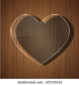 Vector glass heart on wooden background. Eps 10