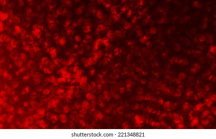 Vector glitter vintage lights background. Red defocused.