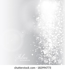 Vector glittery lights silver abstract background.