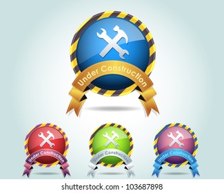 Vector Glossy Round Under Construction Ribbon Icon/Button and multicolored