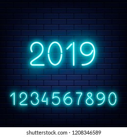 Vector glowing neon blue numbers set with 2019 new year at middle at dark brick wall background. Bar, pub signage design elements, elluminated electric numerical elements collection illustration