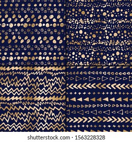 Vector gold foil hand drawn doodle borders seamless patterns. Geometric abstract sets on dark blue background 