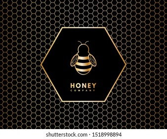 Vector gold honeycomb and bee isolated from black background for your design.