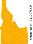 Vector Gold map of Idaho State. Map of Idaho State is isolated on a white background. Gold items mosaic based on solid yellow map of Idaho State.