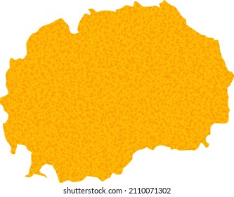 Vector Gold map of Macedonia. Map of Macedonia is isolated on a white background. Gold particles pattern based on solid yellow map of Macedonia.