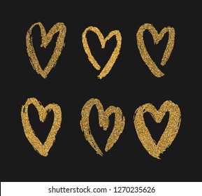 Vector gold paint hearts set isolated on black background. Glitter design elements for Valentine's Day, wedding, poster, invitation, engagement cards. Gold hand drawn hearts. Brush smears. 