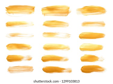 Vector gold paint smear stroke stain set. Abstract gold glittering textured art illustration. Gold Texture Paint Stain Illustration. Hand drawn brush strokes vector elements. Wet, Dry Acrilyc strokes.