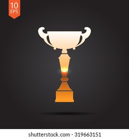 Vector gold trophy goblet icon on dark background . Winner award 