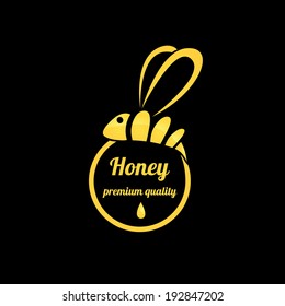 vector golden bee icon on black background. abstract bee silhouette