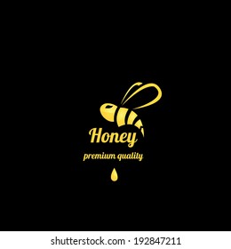 vector golden bee icon on black background. abstract bee silhouette