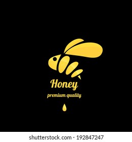 vector golden bee icon on black background. abstract bee silhouette