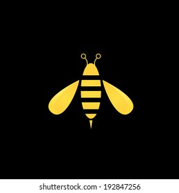 vector golden bee icon on black background. abstract bee silhouette