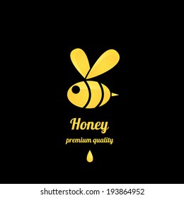 vector golden bee icon on black background. abstract bee silhouette