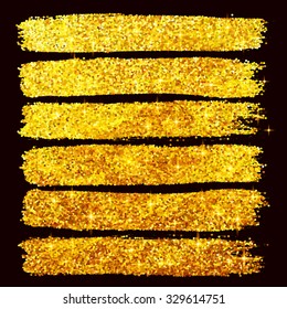 Vector golden glitter brushstrokes set isolated at black background