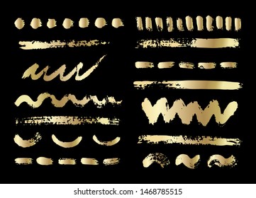Vector golden ink and paint  textures set of strokes,spots,stains and dashes.Grungy hand drawn elements for your design isolated on black background