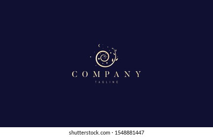 Vector golden logo on which an abstract image of nature in the form of a spiral with leaves and stars.