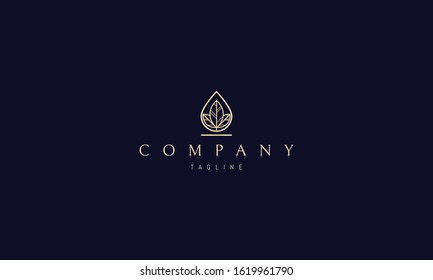 Vector golden logo on which an abstract image of a drop in the center of which leaves.