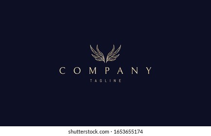 Vector golden logo on which an abstract image of wings in the form of leaves.