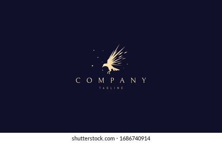 Vector golden logo on which an abstract image of a flying raven with sharp wings.