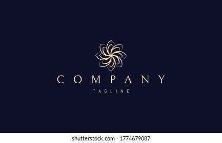 Vector golden logo on which an abstract image of a beautiful flower with petals.