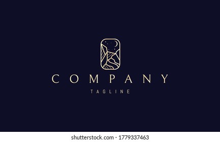 Vector golden logo on which an abstract image of a mountain landscape with the moon.