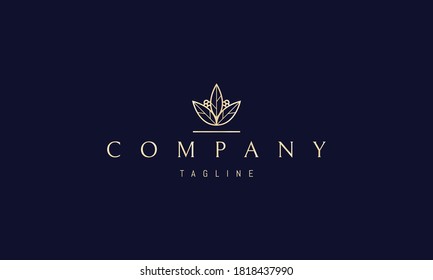 Logo de oro vectorial en el que una imagen abstracta y elegante de una planta con bayas y hojas.