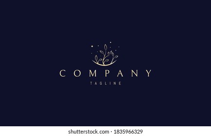 Vector golden logo on which an abstract image of a flowering plant.