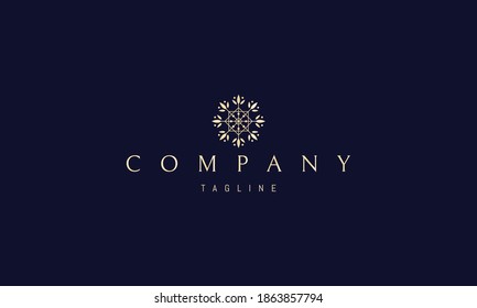 Vector golden logo on which an abstract image of Shamballa with floral elements.