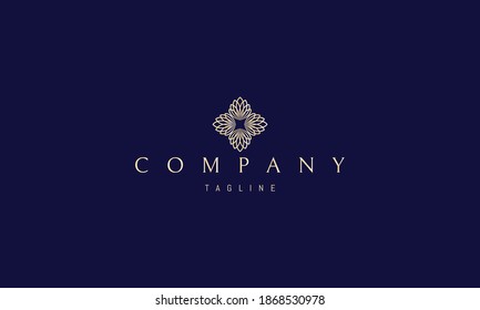 Vector golden logo on which an abstract image of a floral pattern in the form of a cross.