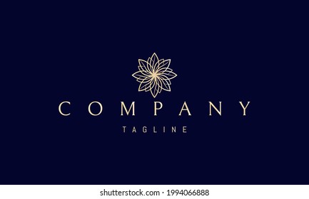 Vector golden logo on which an abstract image of a floral pattern in a linear style.